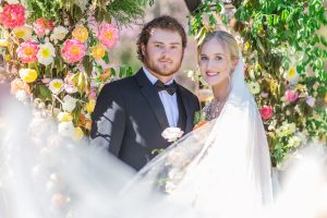 Valley Mills Farm Wedding Couple in front of floral arch during Southern Styled Shoot
