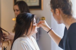 Bride having hair & makeup completed